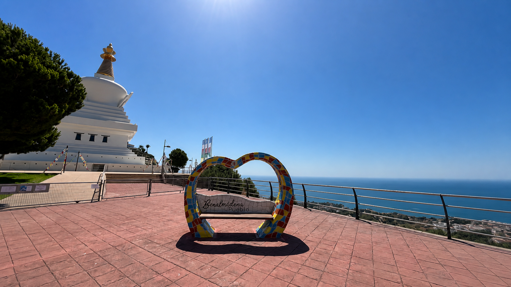 Buddhist stupa and a colorful heart-shaped bench overlooking the Mediterranean in Benalmádena